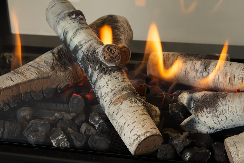 Valor LX1 Pier gas fireplace with birch logs