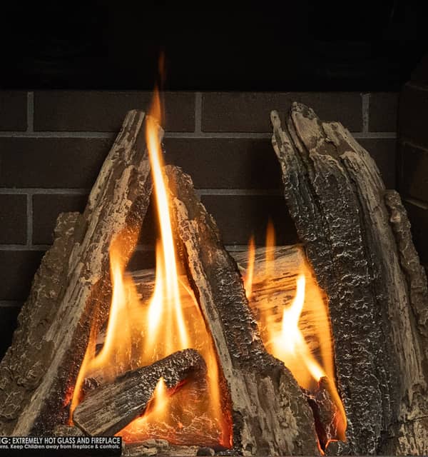 Valor Portrait gas fireplace with traditional logs
