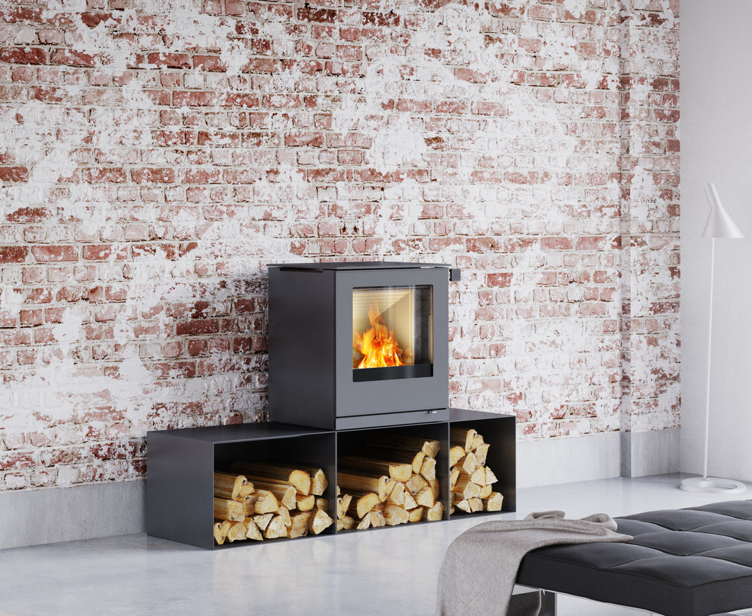 Rais Q-Tee 2 wood stove on a high base with storage boxes