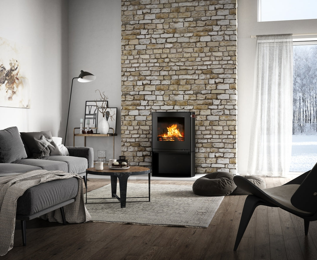 Rais Q-Tee 2C wood stove on a base in a living space