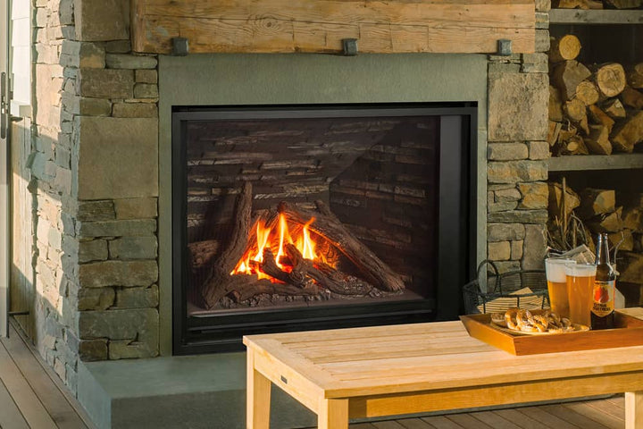 Valor H6 gas fireplace with traditional logs and ledgestone liner