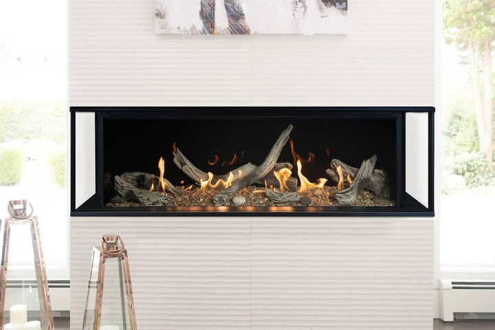 Valor LX2 3-sided gas fireplace with driftwood logs and reflective glass liner