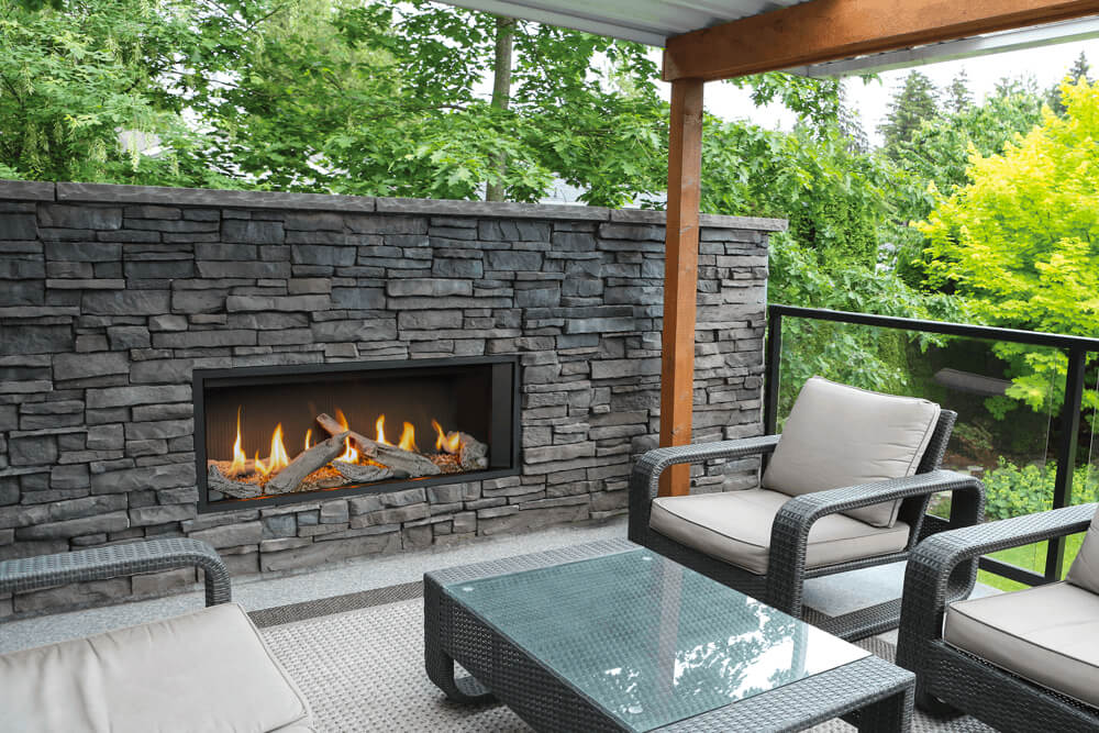 Valor L1 linear gas fireplace with driftwood logs and fluted black liner