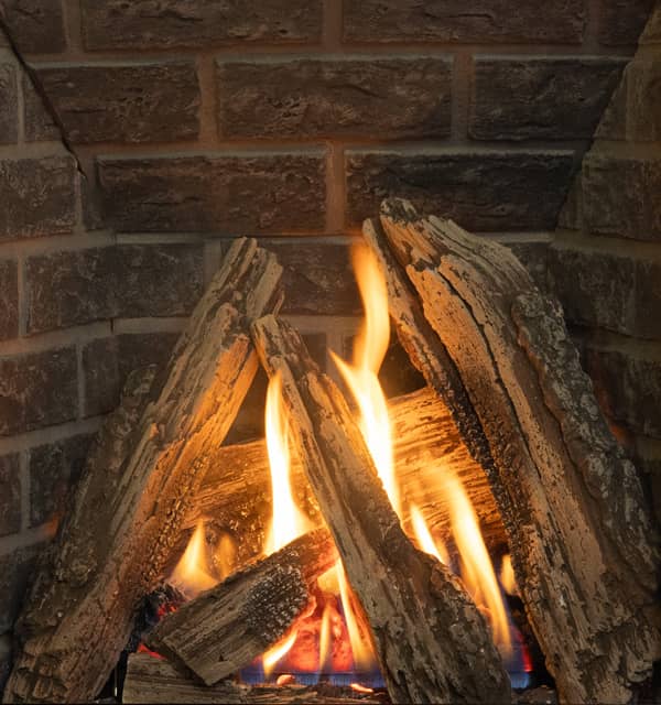Valor P2 gas fireplace with traditional logs