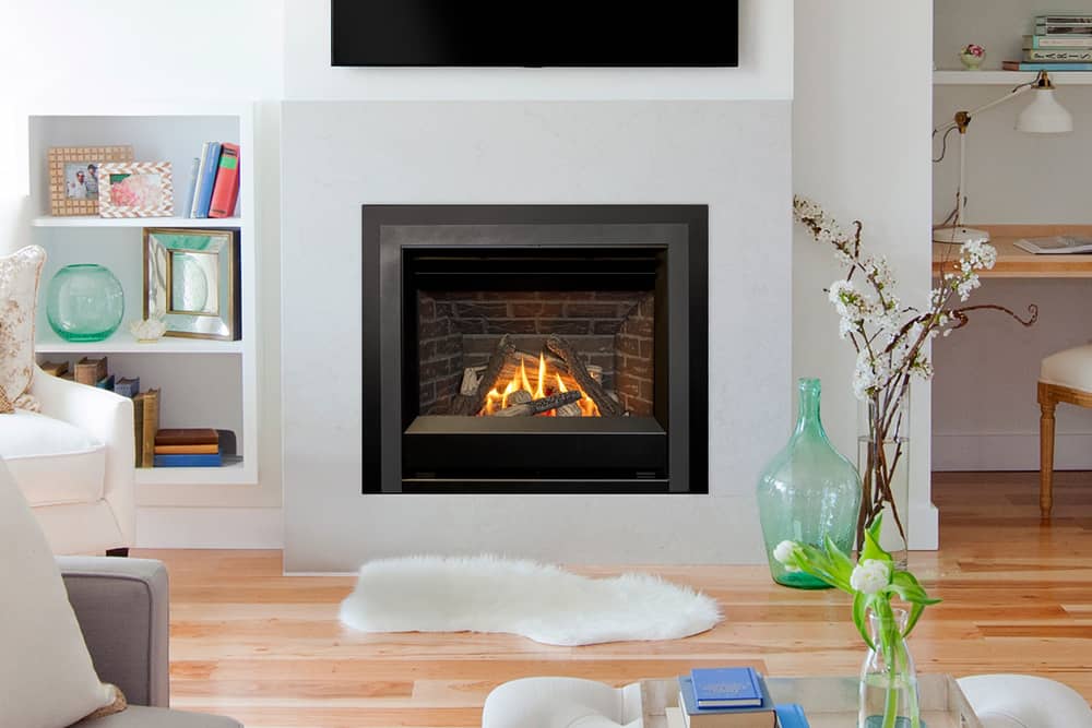 Valor Horizon gas fireplace with traditional logs, red brick liner, and Clearview front